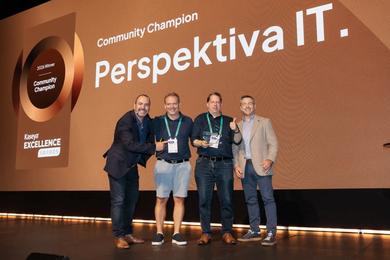 Four people from Perspektiva IT on stage collecting the Community Champion award at the Kaseya Excellence Awards 2026